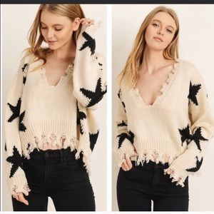 HP distressed ivory sweater with stars